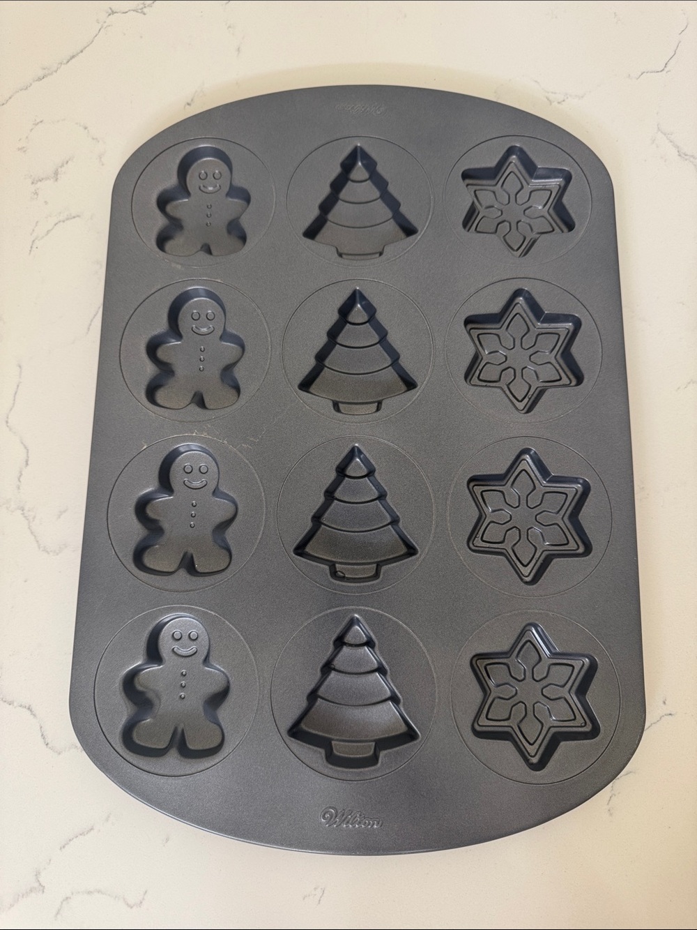 Wilton Nonstick Holiday Cookie Mold in Gray. Gingerbread, snowflake, tree